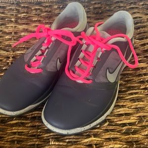 Worn twice women’s Nike golf shoes. Gray with hot pink laces. Size 6. Lovely